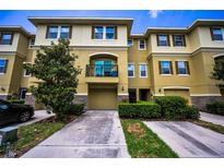 Beautiful multi-story townhome with a front-loading garage and a cozy second-story balcony at 5529 White Marlin Ct, New Port Richey, FL 34652