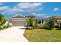 Charming one-story home featuring stone accents and a well-maintained lawn in a desirable neighborhood at 2247 Midnight Pearl Dr, Sarasota, FL 34240