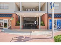 Building entrance featuring modern architectural design, brick accents, and prominent numerical signage at 1010 Central Ave # 227, St Petersburg, FL 33705