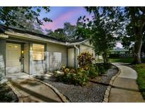 Charming single-story home with cozy front yard landscaping and inviting entrance at 39650 Us Highway 19 N # 143, Tarpon Springs, FL 34689
