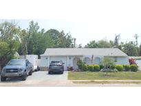 Charming single story home with a well-maintained lawn, featuring mature landscaping and a private driveway at 6318 Ridge Crest Dr, Port Richey, FL 34668