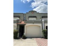Charming townhome featuring an attached garage and a private gated entrance at 2914 W Gandy Blvd # C, Tampa, FL 33611