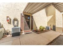 Inviting front entrance with covered porch and well-maintained landscaping for a welcoming arrival at 501 E Bay Dr # 102, Largo, FL 33770