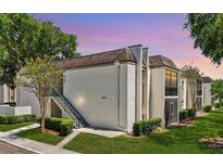 Well-maintained condo building with lush landscaping, staircase and excellent curb appeal at 801 Russell Ln # 252, Brandon, FL 33510