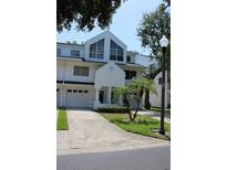 Inviting townhome with a private garage and well-maintained landscaping at 9722 Indian Key Trl # 116, Seminole, FL 33776