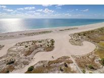 Breathtaking aerial view of the pristine beach and glistening ocean at a beachfront community at 1270 Gulf Blvd # 1901, Clearwater Beach, FL 33767