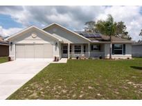 Charming single-story home with well-maintained lawn, two car garage and solar panels at 3642 Fantasy Way, Brooksville, FL 34604
