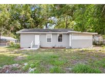 Charming single-story home with a well-maintained lawn and cozy front porch at 4804 N 18Th St, Tampa, FL 33610