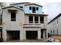 Exterior view of a new construction home showing the frame of the facade and two-car garage at 503 W Warren Ave # 1, Tampa, FL 33624