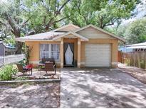 Charming single-Gathering home featuring a cozy front porch and well-manicured landscaping at 5149 4Th St, Zephyrhills, FL 33542