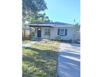Charming single-story home featuring a cozy front porch and well-maintained lawn at 4611 17Th N Ave, St Petersburg, FL 33713