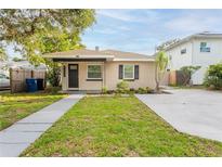 Charming single-story home with a well-maintained lawn and a cozy front porch at 4611 17Th N Ave, St Petersburg, FL 33713