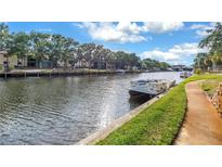 Beautiful waterfront view with lush landscaping in this well-maintained community at 6309 Newtown Cir # 9B2, Tampa, FL 33615