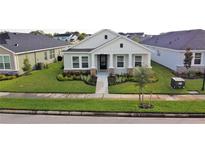 Charming single-story home featuring a well-manicured lawn and stone-accented facade at 28547 Hillcrest Valley Blvd, Wesley Chapel, FL 33543