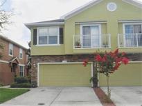 Inviting two-story home with a two-car garage and charming balconies at 5107 5Th N Way, St Petersburg, FL 33703