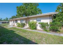 Charming single-story home featuring well-maintained landscaping and a welcoming entrance at 725 2Nd Ne Ave, Largo, FL 33770