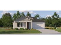 Charming single-story home with a neatly manicured lawn and an attached two car garage at 11757 E 74Th Cir, Palmetto, FL 34221