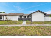 Charming single-story home featuring a well-maintained lawn and a private front entrance at 5306 Marlwood Ct, Tampa, FL 33624