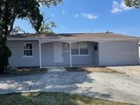 Charming single-story home with a well-maintained front yard and covered entrance at 6102 Massachusetts Ave, New Port Richey, FL 34653