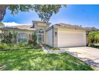 Charming one-story home with well-manicured lawn and appealing landscaping at 1603 Scotch Pine Dr, Brandon, FL 33511