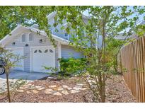 Charming two-story home with a two car garage and beautiful rock and bark landscaping at 3053 S Concordia Ave # A, Tampa, FL 33629