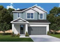 Charming two-story home featuring a two-car garage, a well-manicured lawn, and professionally landscaped flower beds at 31343 Pendleton Landing Cir, Wesley Chapel, FL 33545