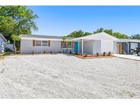 Charming single-story home with a well-maintained yard and modern painted brick exterior at 3401 Truman Dr, Holiday, FL 34691