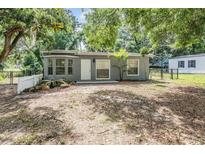 Charming single-story home featuring a well-kept yard and fenced perimeter at 7347 Pulsar St, New Port Richey, FL 34652