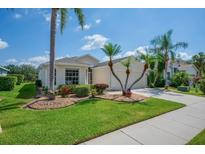 Charming single-story home with well-maintained landscaping and a neatly manicured green lawn at 8223 Haven Harbour Way, Bradenton, FL 34212
