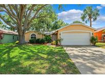 Charming home featuring a well-manicured lawn and a two-car garage at 11510 92Nd Way, Largo, FL 33773