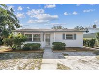 Charming single-story home featuring a well-maintained lawn, tidy landscaping, and neutral-tone exterior paint at 3818 Grove S St, St Petersburg, FL 33705