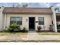 Charming home featuring a well-maintained facade and inviting walkway at 1510 Mission Hills Blvd # 19-F, Clearwater, FL 33759