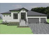 Charming single-story home featuring a 2-car garage, manicured lawn, and a welcoming front entrance at 17282 Carroway Ln, Punta Gorda, FL 33955
