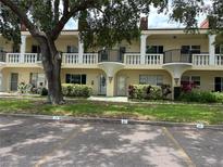 Charming condominium featuring classic architecture, private balconies, and landscaped grounds at 2295 Mexican Way # 41, Clearwater, FL 33763