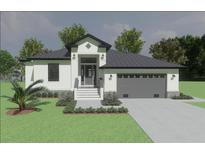 Beautiful one-story home featuring a symmetrical front elevation, gray roof, and a two-car garage at 24260 Vincent Ave, Punta Gorda, FL 33955