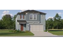 Charming two-story home with a two-car garage, landscaped yard, and a welcoming front entrance at 11733 E 71St Ter, Palmetto, FL 34221