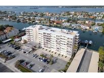 Luxury waterfront building featuring a sophisticated design, convenient parking, and stunning water views at 223 Island Way # 7F, Clearwater Beach, FL 33767