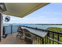 Relaxing balcony with comfortable seating and expansive waterfront views at 2700 Bayshore Blvd # 11405, Dunedin, FL 34698