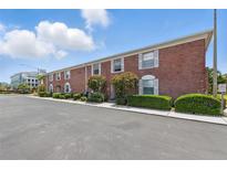 Charming two-story red brick townhome with manicured landscaping at 3580 38Th S Ave # 95, St Petersburg, FL 33711