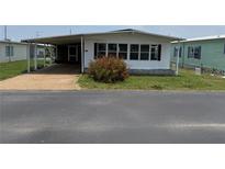 Charming single-story home with carport and well-maintained lawn at 37832 Madeira Ave, Zephyrhills, FL 33541