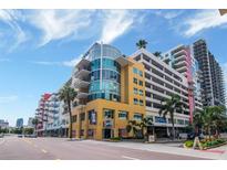 Stylish building exterior featuring balconies, vibrant colors and well-manicured landscaping in an urban setting at 1120 E Kennedy Blvd # 1512, Tampa, FL 33602