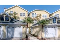 Charming townhome with attached garage and well-maintained landscaping with palms at 2648 Sabal Springs Dr # 2, Clearwater, FL 33761