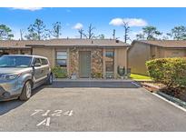 Charming single-story home with stone accents, convenient parking and well maintained landscaping at 7124 Barclay Ave # A, Spring Hill, FL 34609