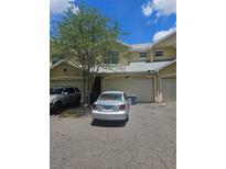 Townhouse featuring an attached garage and neutral stucco exterior, offering convenient parking and curb appeal at 7187 53Rd N St, Pinellas Park, FL 33781