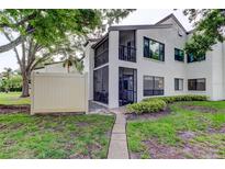 Charming two-story condo with a screened lanai and balcony, nestled in a landscaped community at 700 Starkey Rd # 1216, Largo, FL 33771