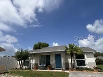 Charming single-story home featuring a well-manicured lawn and a welcoming front entrance at 9128 Suffield Ct, Tampa, FL 33615