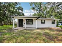 Charming one-story home featuring a freshly painted exterior and a welcoming front porch at 2220 3Rd E Ave, Bradenton, FL 34208