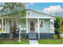 Charming single-story home featuring a covered front porch and well-maintained landscaping at 2320 E 12Th Ave, Tampa, FL 33605