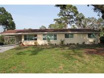 Charming one-story home featuring a carport and well-maintained landscaping at 406 2Nd Sw St, Ruskin, FL 33570