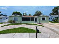 Charming single-story home with a well-maintained lawn and inviting curb appeal at 5672 62Nd N Way, St Petersburg, FL 33709